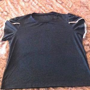 Pretty green top with white design on sleeves